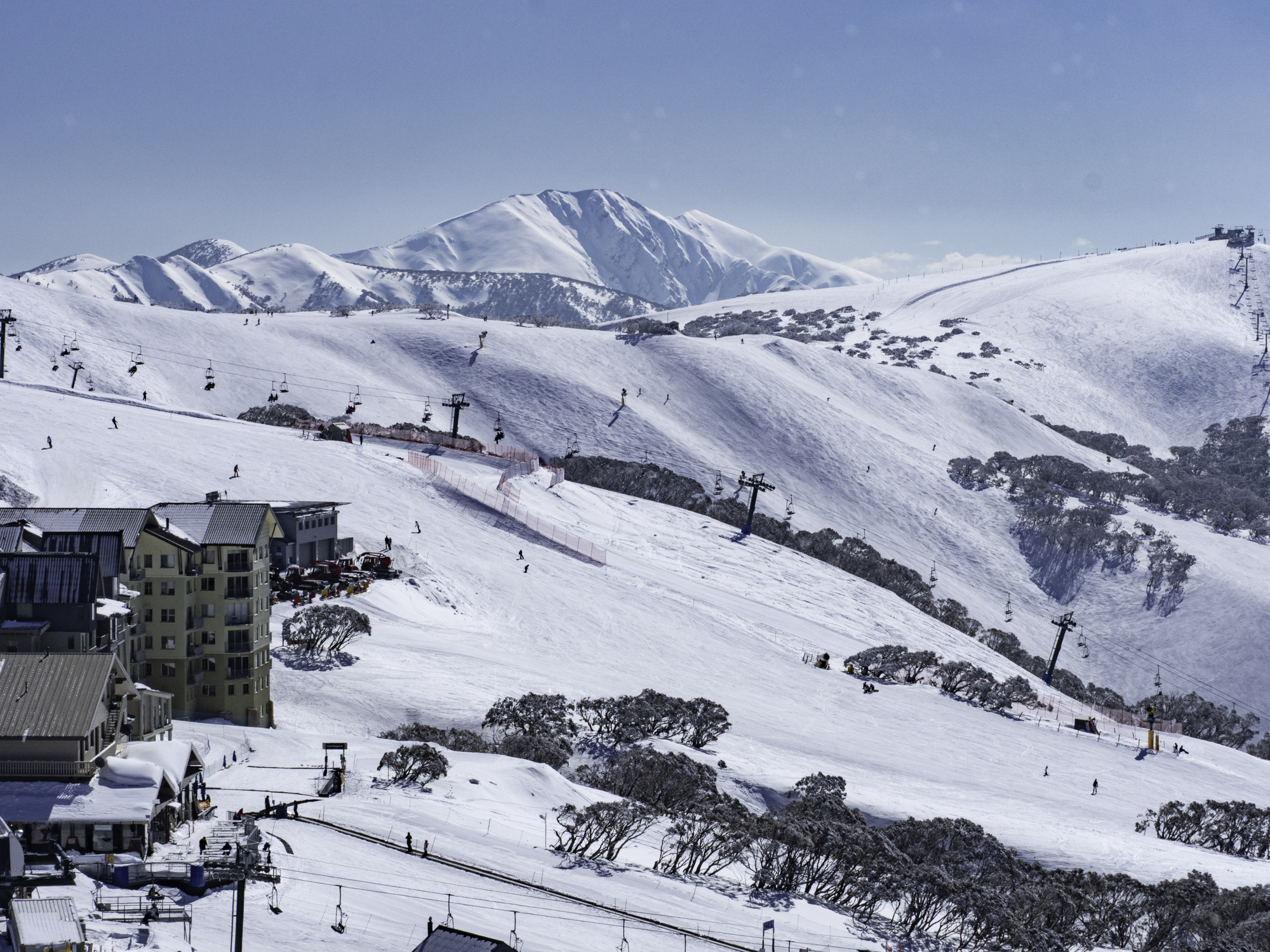 Ski runs at Mt Hotham in Victoria with Mt Feathertop in the background during a good Australian snow season. Source: iStock/Chris Gordon