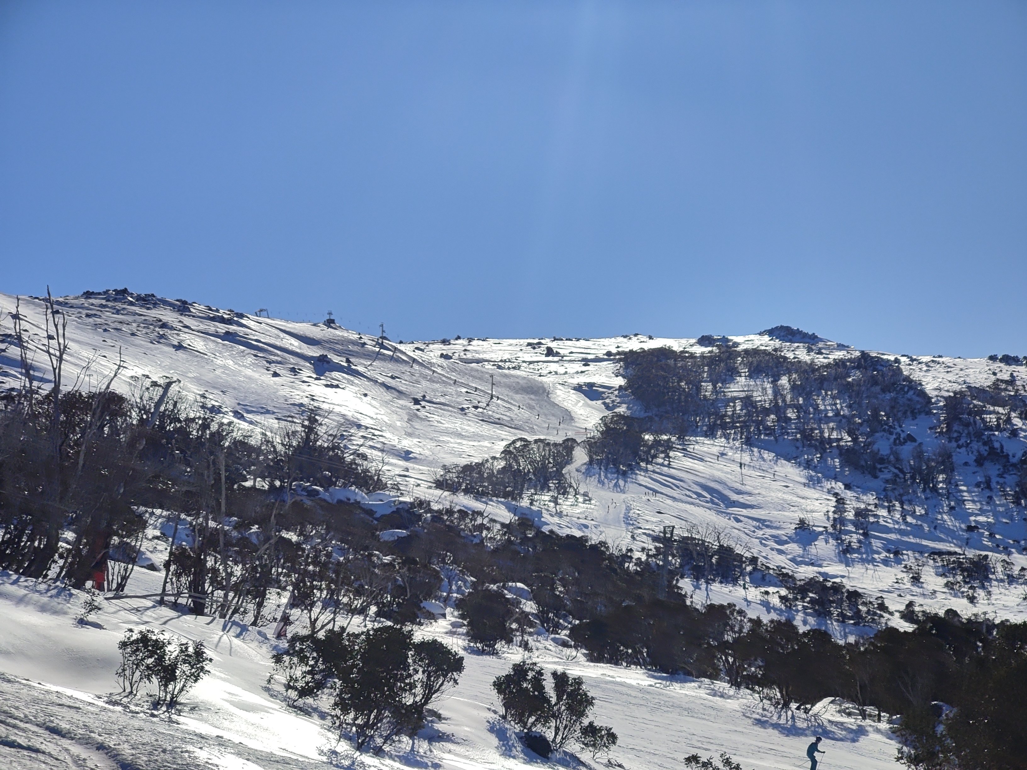 Sunny skies above the upper slopes of Thredbo on Wednesday, July 15, 2026. Source: Rusty J.