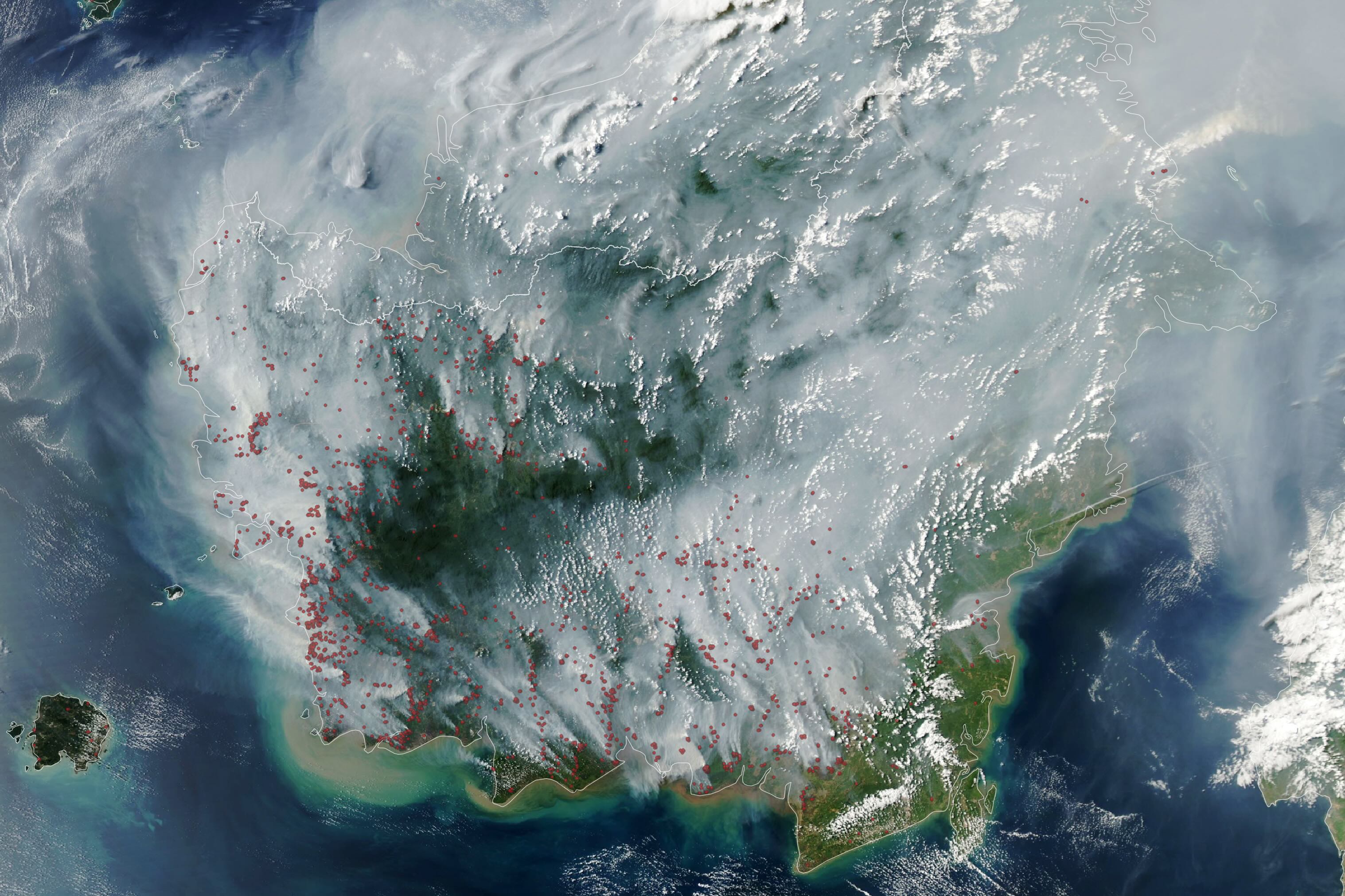 Smoke and fire hotspots (red dots) over Borneo on September 1, 2026. Source: NASA / Aqua.
