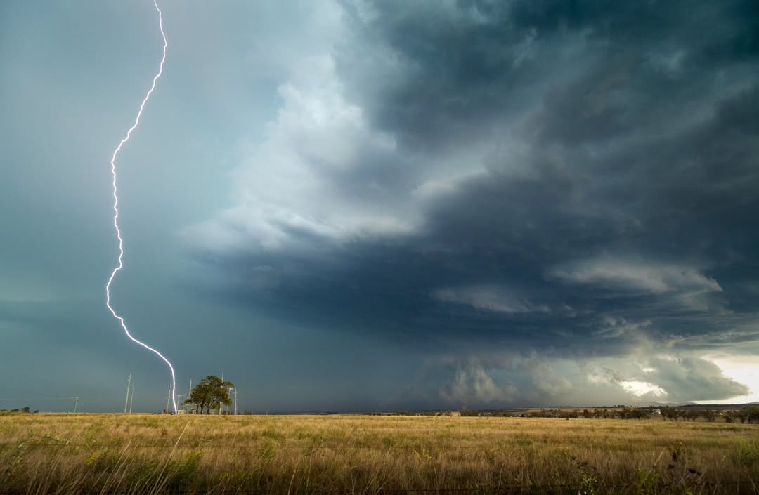 A thunderstorm causing a cloud-to-ground lightning strike near Greenmount, Qld on Sunday, November 2, 2025. Source: @_benjaminfraser / Instagram.