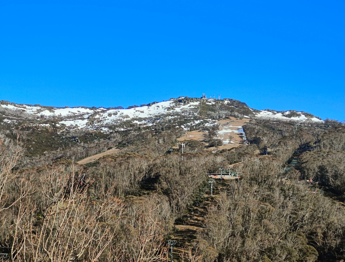 The mostly bare slopes of Thredbo on Thursday, September 17, 2026, a time of year when at least the upper half of the mountain is usually still skiable. Source: Rusty J.